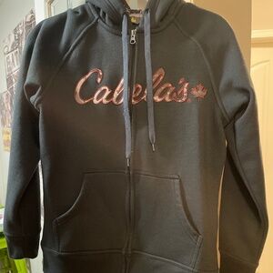 Cabelas hoodie pullover black/ camo hood logo on front orange hunting fishing